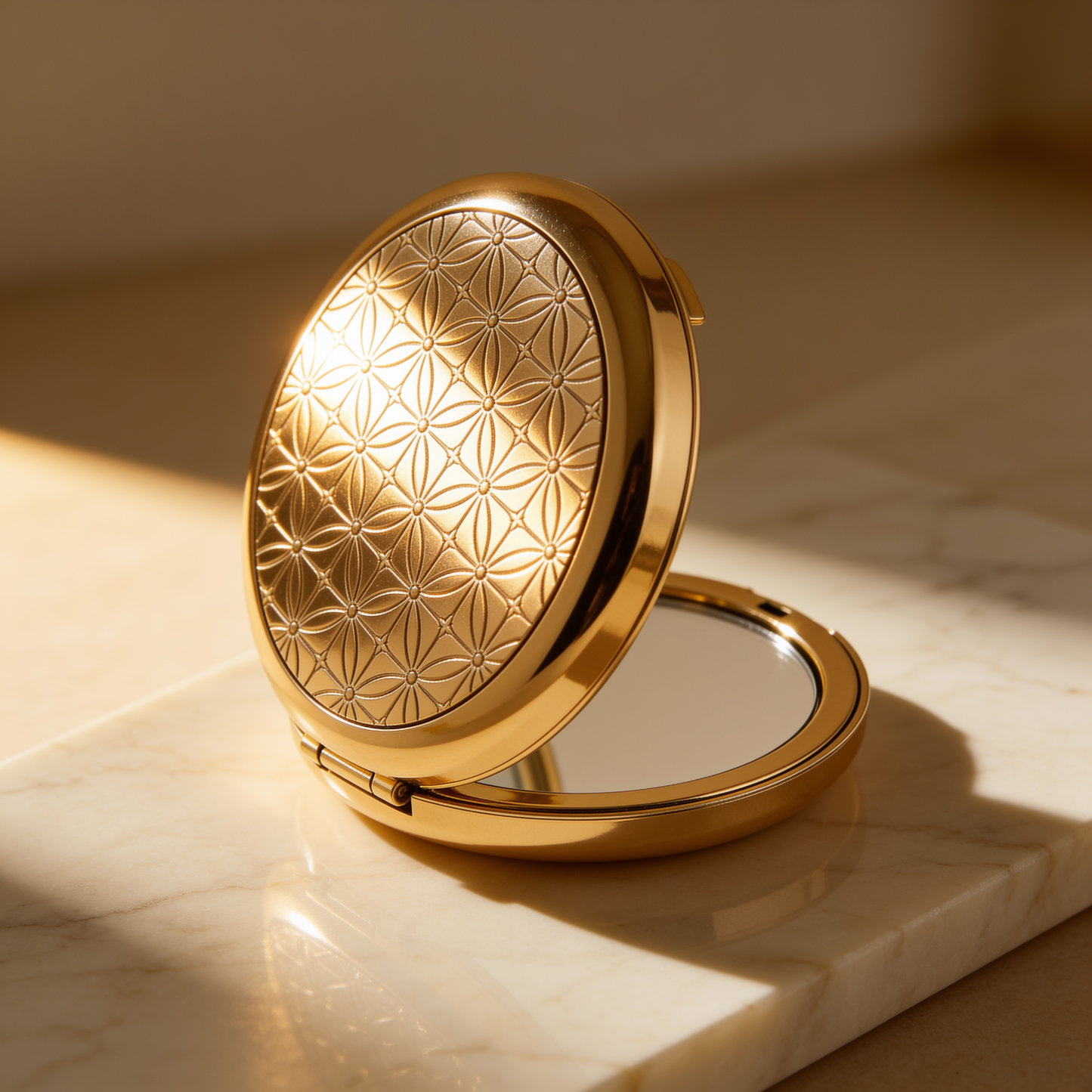Round Compact Mirror in Gold with Embossed Geometric Lid